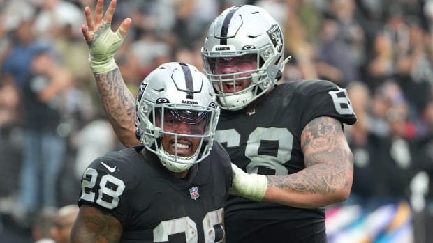 Oct 23, 2022; Paradise, Nevada, USA; Las Vegas Raiders running back Josh Jacobs (28) celebrates with Las Vegas Raiders center Andre James (68) after scoring a touchdown against the Houston Texans during the second half at Allegiant Stadium.